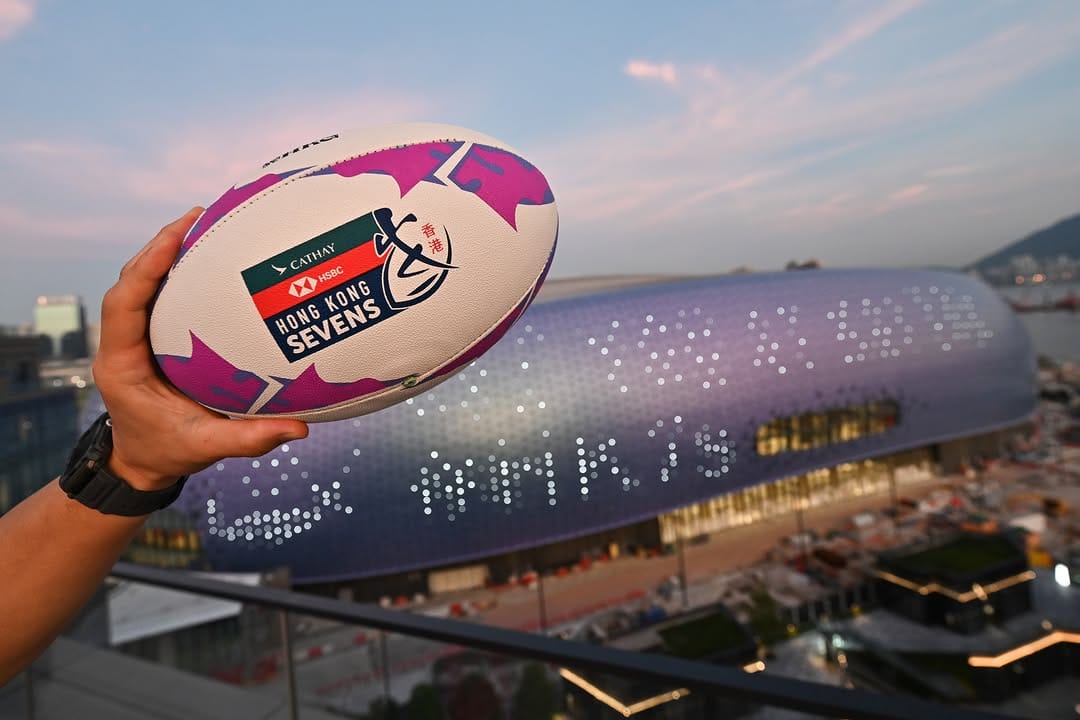 Hand holding rugby ball